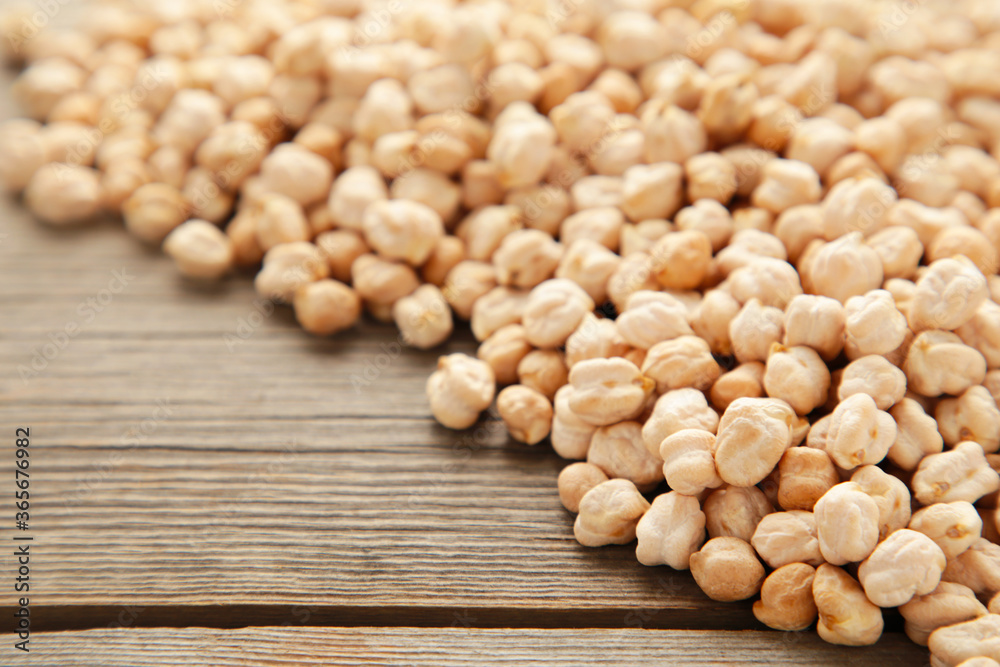 Dry raw organic chickpeas on grey wooden background. Dry raw organic chickpeas on grey wooden background.