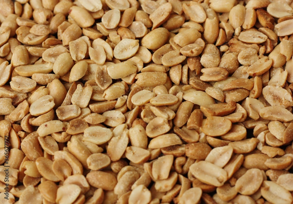 Delicious roasted peanuts with salt close up view Delicious roasted peanuts with salt close up view