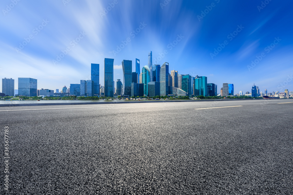 Asphalt road and modern city buildings in Shanghai,China.