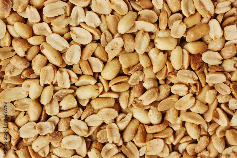 Delicious roasted peanuts with salt close up view Delicious roasted peanuts with salt close up view