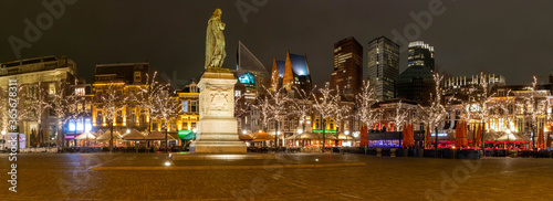 The Hague main square by night in winter panorama with statue of Willem of Orange 