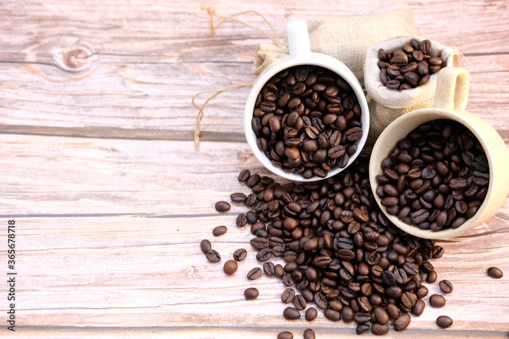 coffee beans on old wood table background, space for text coffee beans on old wood table background, space for text