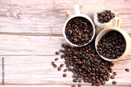 coffee beans on old wood table background, space for text