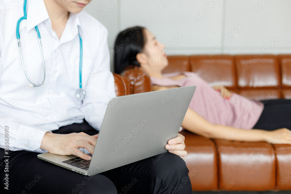 Male doctors in uniform are using laptops for medical work at modern hospital. empty monitor for your design. Male doctors in uniform are using laptops for medical work at modern hospital. empty monitor for your design.