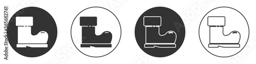 Black Waterproof rubber boot icon isolated on white background. Gumboots for rainy weather, fishing, gardening. Circle button. Vector Illustration.