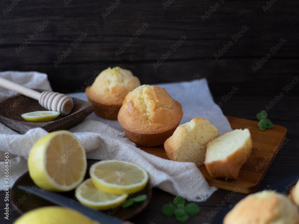 Lemon Muffins on Black Table with Copy Space. Lemon Cup Cakes Rustic Shot. Lemon Muffins Flatlay. Lemon Muffins on Black Table with Copy Space. Lemon Cup Cakes Rustic Shot. Lemon Muffins Flatlay.