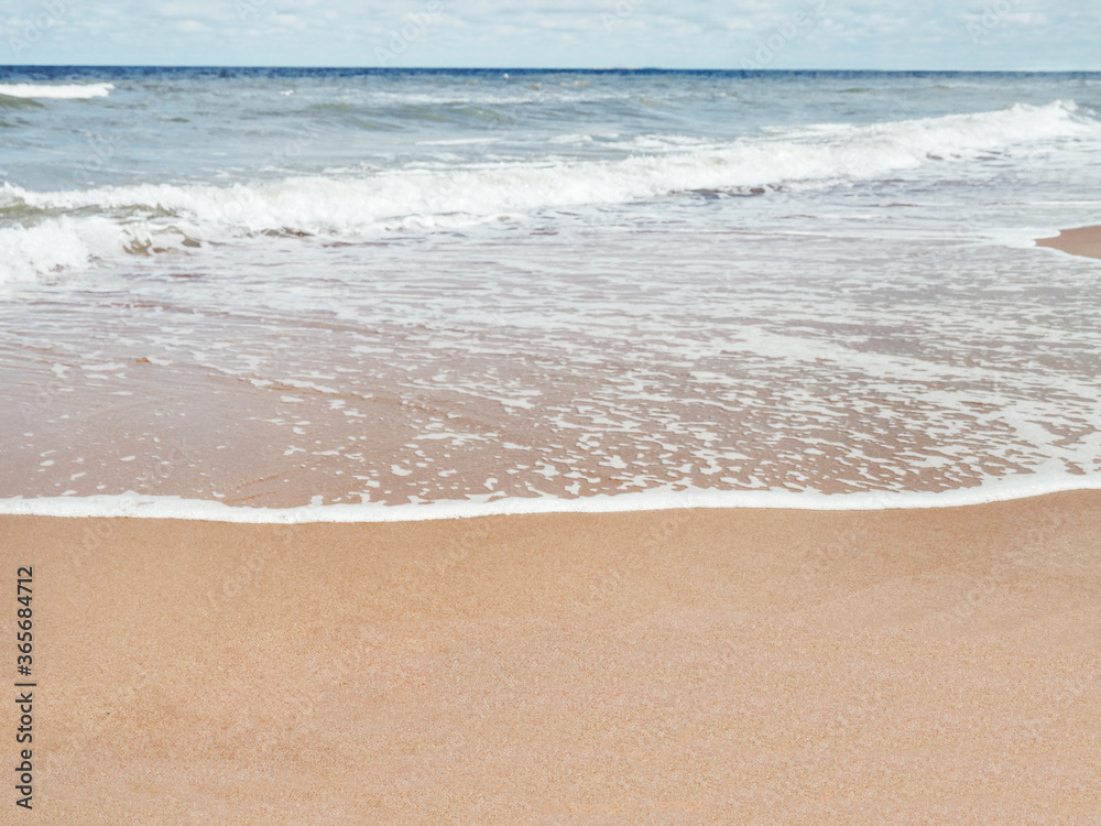 Sea coast with soft surf. Sandy beach. Summer vacation on seaside. Sea coast with soft surf. Sandy beach. Summer vacation on seaside.