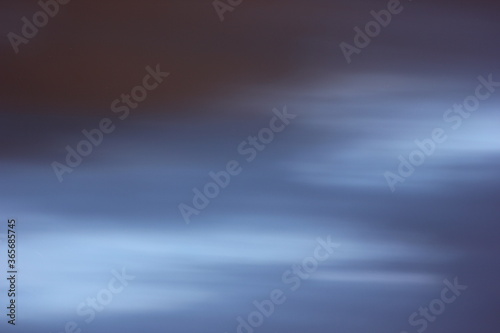 blurred natural background with clouds