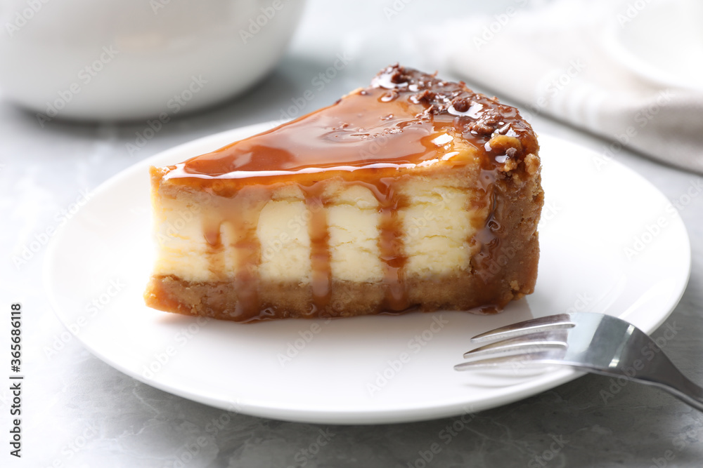 Piece of delicious cake with caramel served on marble table Piece of delicious cake with caramel served on marble table