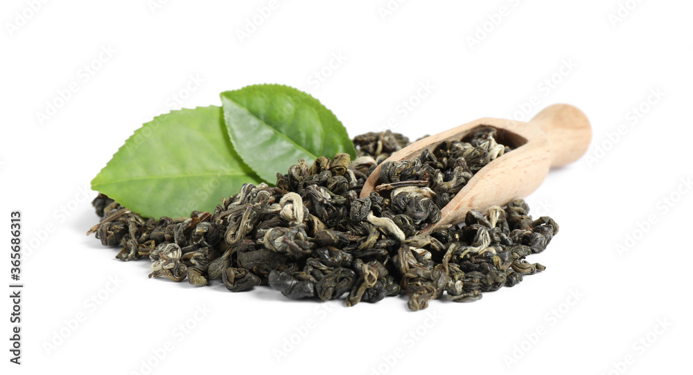 Fresh and dry leaves of tea plant with wooden scoop on white background Fresh and dry leaves of tea plant with wooden scoop on white background