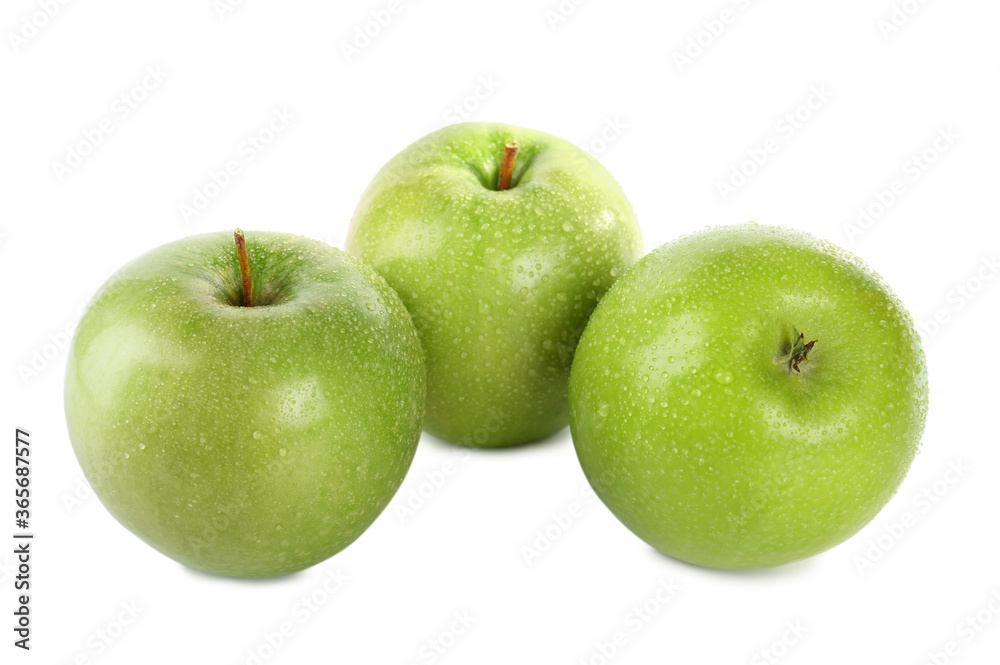 Fresh juicy green apples with water drops isolated on white Fresh juicy green apples with water drops isolated on white