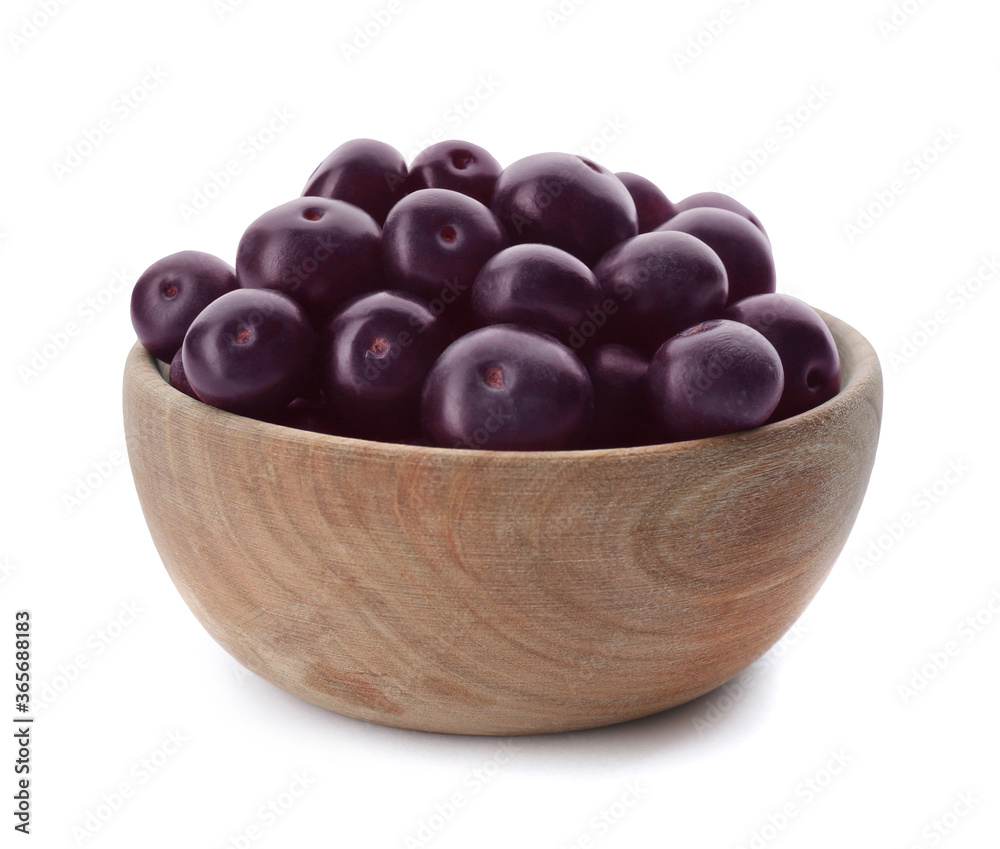 Fresh acai berries in bowl isolated on white Fresh acai berries in bowl isolated on white