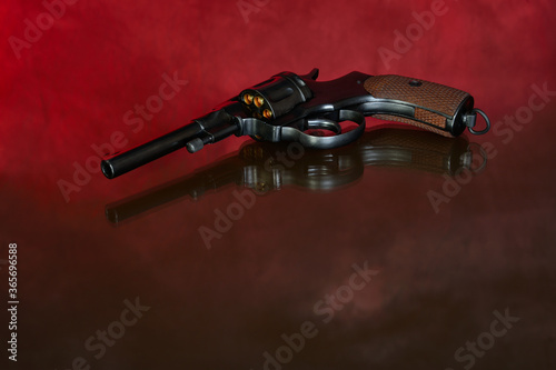 Revolver on red