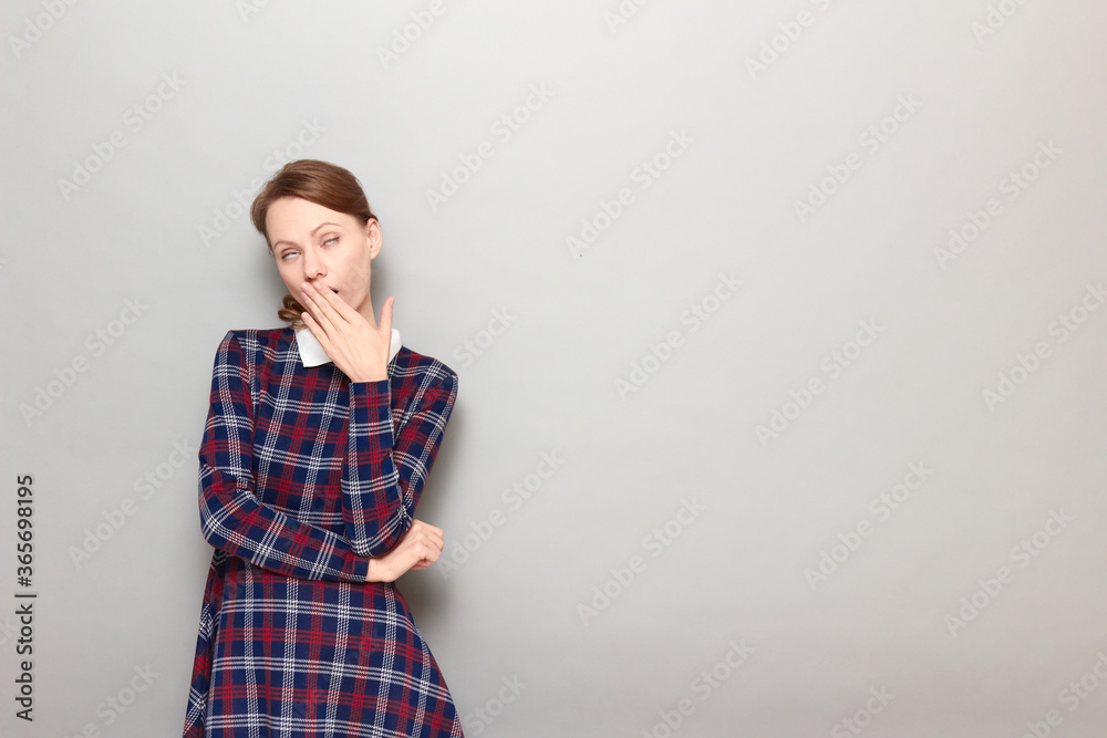Portrait of girl yawning, covering mouth with hand and looking sleepy Portrait of girl yawning, covering mouth with hand and looking sleepy
