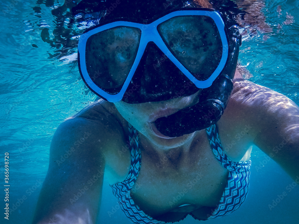 woman snorkeling in amazing blue underwater world banner