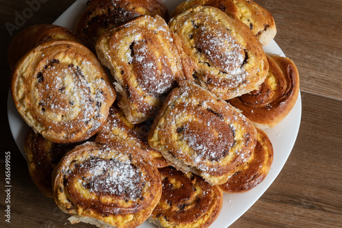 Patties with cottage cheese and raisins piled up on a plate.