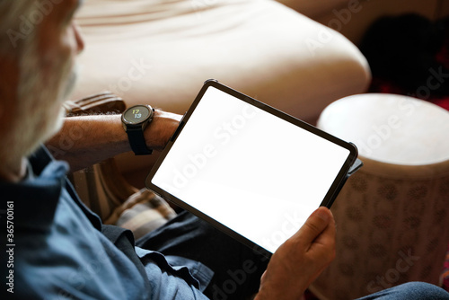 old man white hair with smart watch using pro tablet