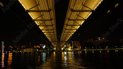 Golden Horn Metro Bridge in Istanbul at night, black sky and sea, Gold color reflection, background