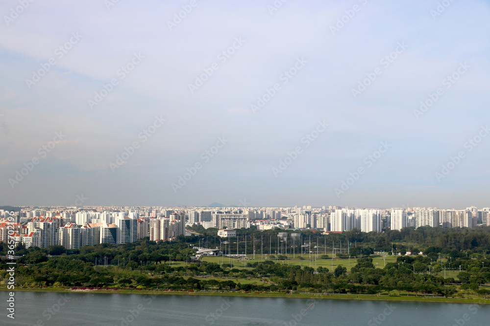 city view of singapore with condominium , HDB building and trees with background of blue sky city view of singapore with condominium , HDB building and trees with background of blue sky