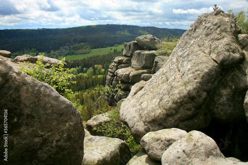 Rock formations in Szczeliniec Wielki in the Stolowe Mountains, the Sudeten range in Poland. The Stolowy Mountains National Park is a great tourist attraction © fotokate