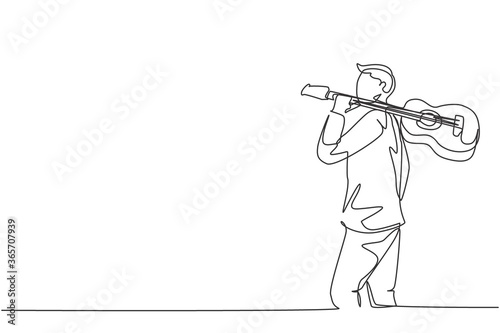 Single continuous line drawing of young happy male guitarist walking while carrying acoustic guitar oh his shoulder. Modern musician artist performance concept one line draw design vector illustration