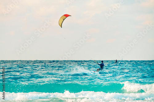 Photography kiteboarder kitesurfer athlete performing kitesurfing kiteboarding tricks unhooc