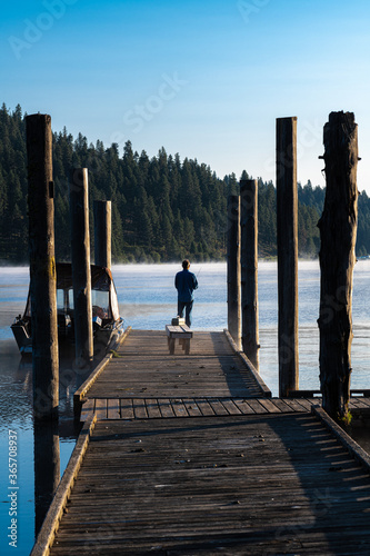 Floating Boat Dock with Fisherman on Chatcolet Lake, ID