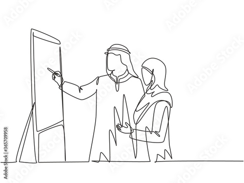 Single continuous line drawing of young muslim manager do presentation to explain job of new assistant. Arab middle east cloth shmagh, kandura, thawb, robe. One line draw design vector illustration