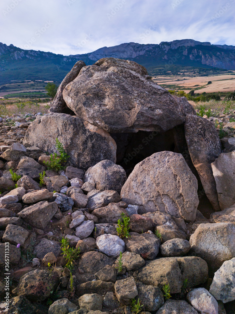 Dolmen in the Alto de la huesera in Laguardia in the Rioja Alavesa with the Sierra de Cantabria in the background. Alava, Basque Country, Spain, Europe