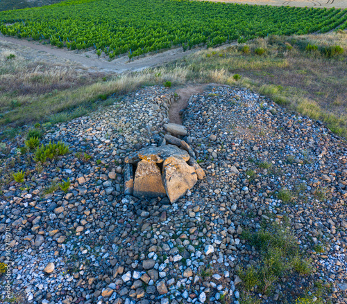 View from a drone of the Dolmen in the Alto de la huesera in Laguardia in the Rioja Alavesa with the Sierra de Cantabria in the background. Alava, Basque Country, Spain, Europe photo