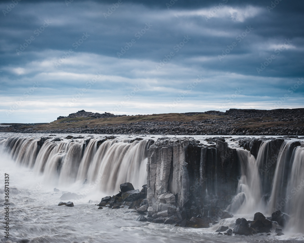 Powerful waterfall in Iceland on a cloudy day Powerful waterfall in Iceland on a cloudy day