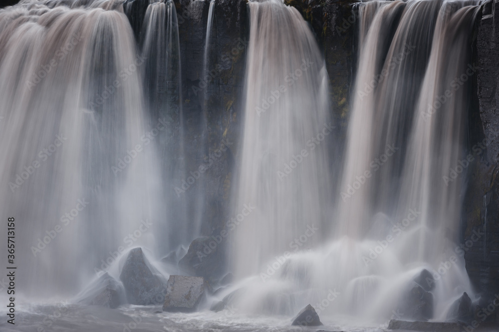 Powerful waterfall in Iceland on a cloudy day Powerful waterfall in Iceland on a cloudy day