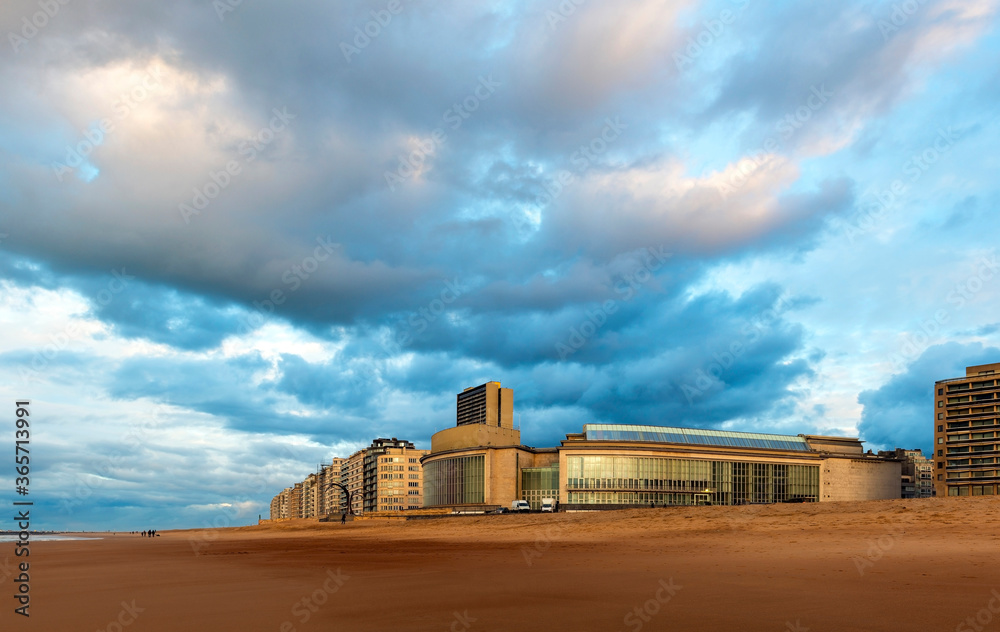 The beach of Oostende (Ostend) with skyline and skyscraper at sunset, Flanders, Belgium. The beach of Oostende (Ostend) with skyline and skyscraper at sunset, Flanders, Belgium.