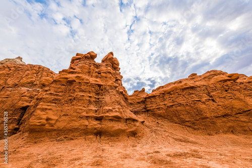 Orange red hoodoo sandstone rock formations view in campground in desert landscape in Goblin Valley State Park  Utah