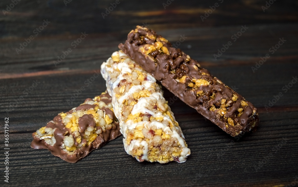 Muesli bars on a wooden table, diet. Selective focus. Muesli bars on a wooden table, diet. Selective focus.