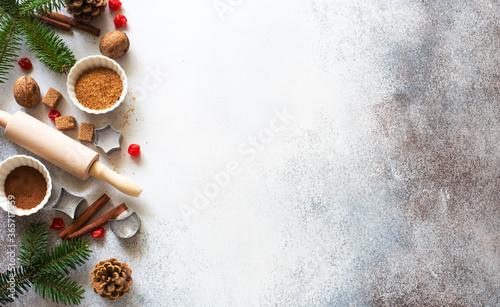 New Year an Christmas stone background with baking ingredients, fir twigs and cones