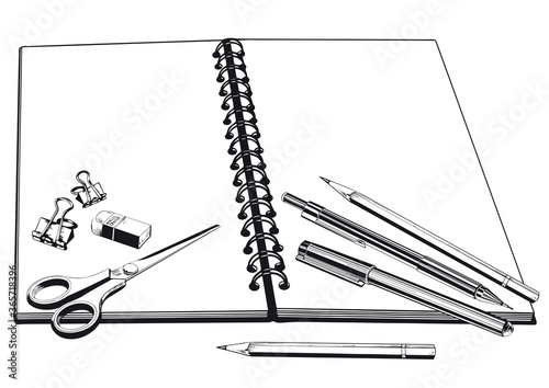 Notebook, scissors and pencils.