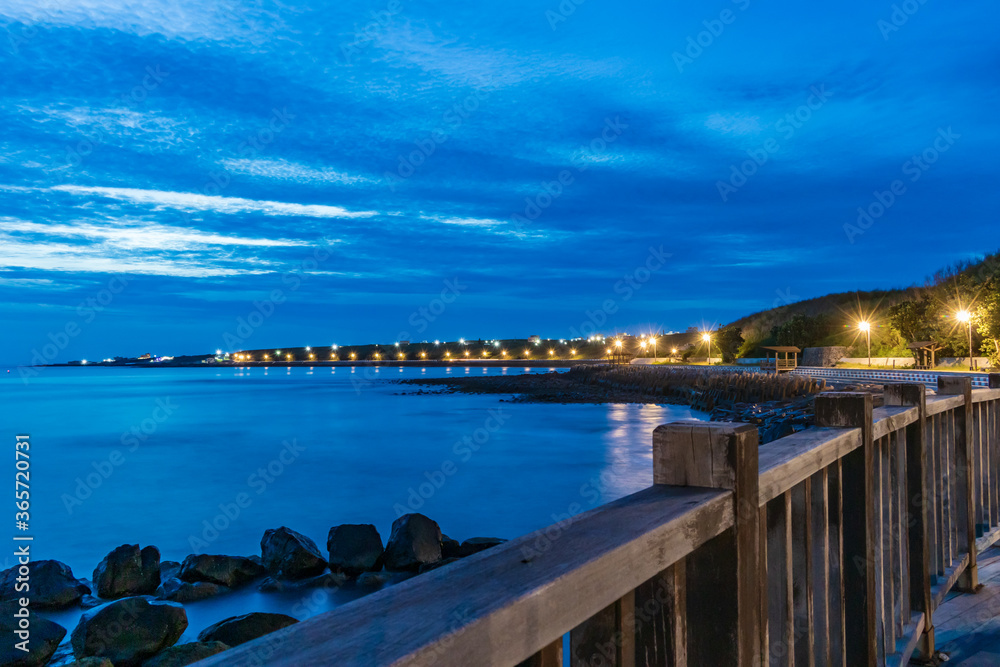 Fototapeta premium The best sunset view of the Chimei island at Western coast in Qimei Township, Penghu, Taiwan