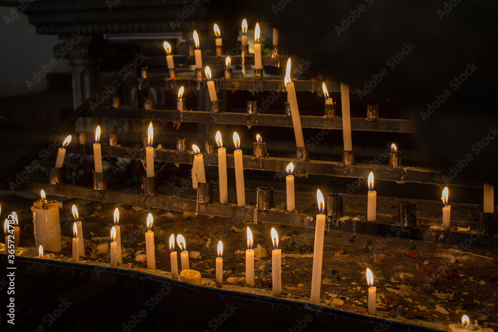 Burning candles in a latin american church