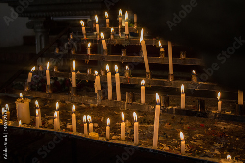 Burning candles in a latin american church