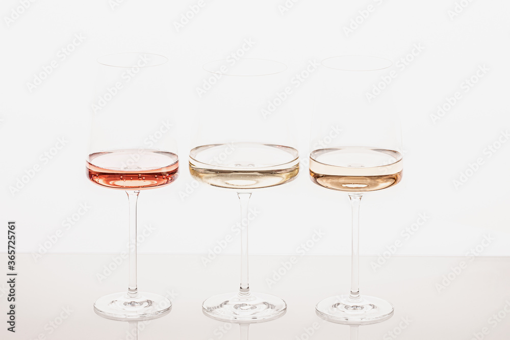 Three glasses of different white and rose wines Three glasses of different white and rose wines