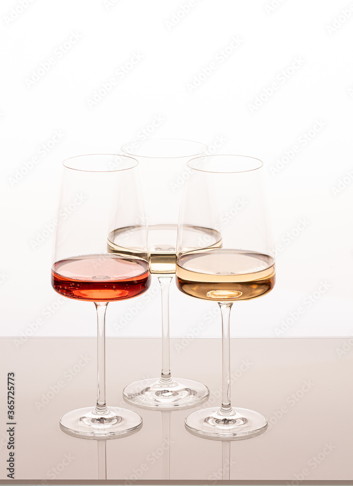Three glasses of different white and rose wines