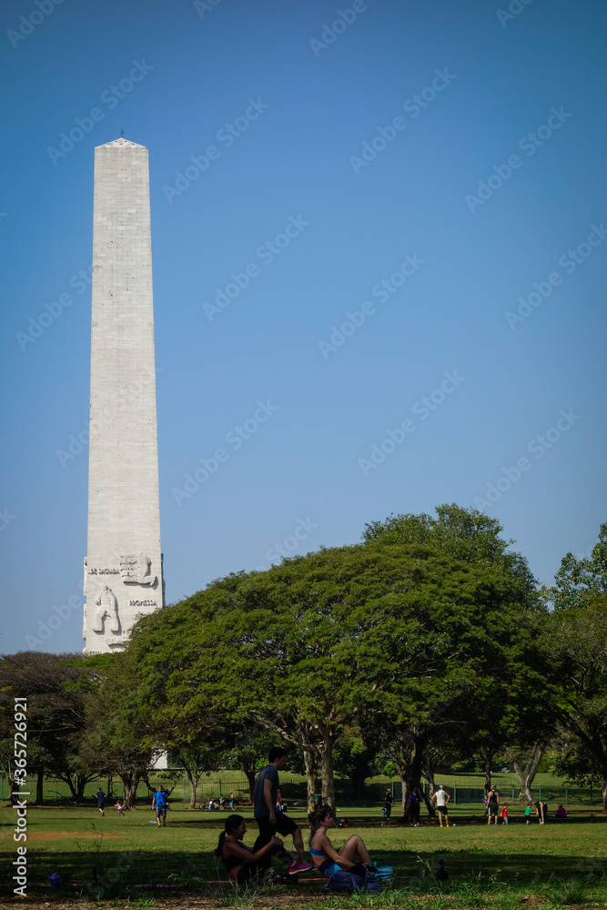 Sao Paulo obelisk, at Ibirapuera park, and people enjoying the day