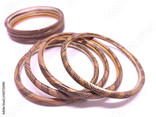 Multicolored Bangles isolated on white background. Selective focus. Bangles are traditionally rigid bracelets, originating from the Indian subcontinent.