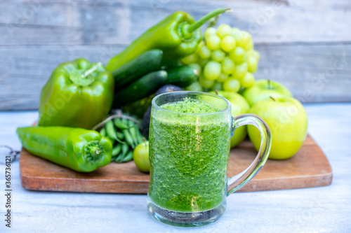 Different type of vegetables and fruits with healthy smoothie