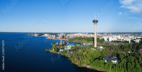 Beautiful summer panorama of Tampere city at summer evening. Blue sky. Amusement park. Finland. photo