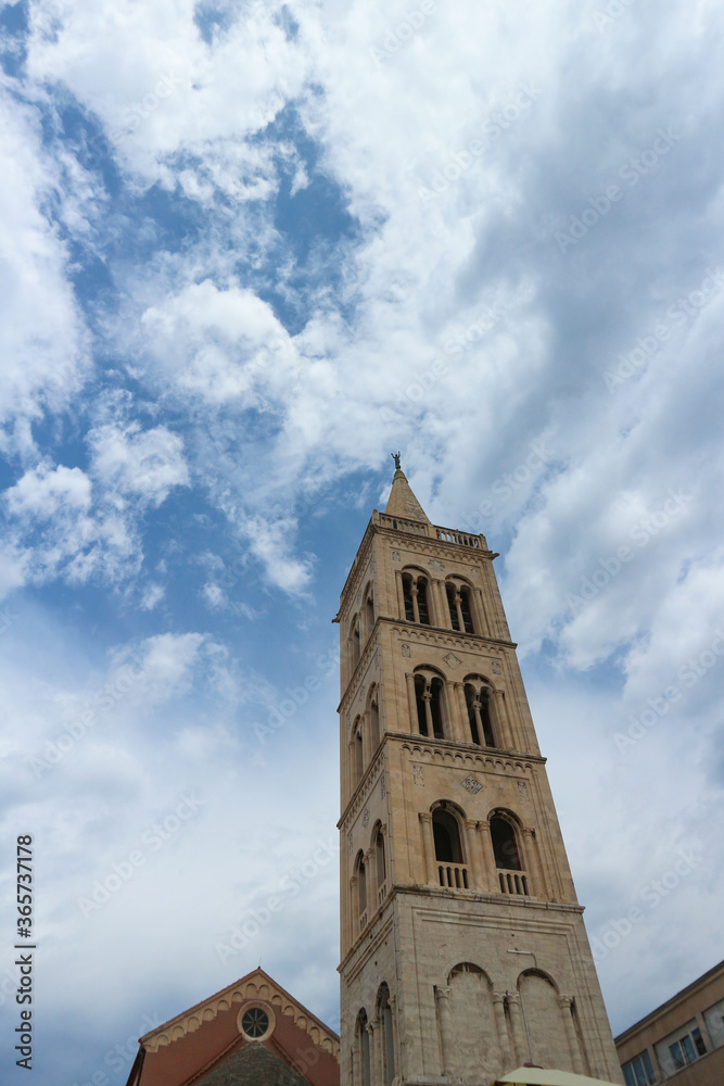Zadar/Croatia-June 25,2018: Bell tower of The Cathedral of St. Anastasia in Zadar, beautiful piece of architecture with mixed styles from gothic, romanesque to the Christian basilica from 4th century
