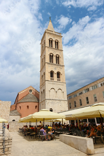 Zadar/Croatia-June 25,2018: Popular tourist square in front of magnificent Zadar cathedral and its gothic tower, popular landmark and example of beautiful, old architecture