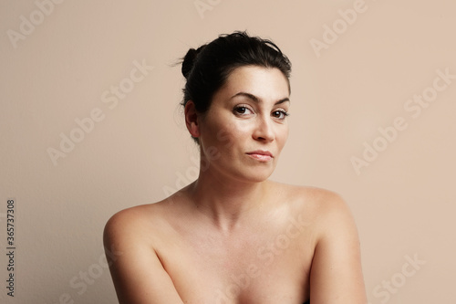 Portrait of mature beauty woman keeping her skin looking great with good beauty habits.