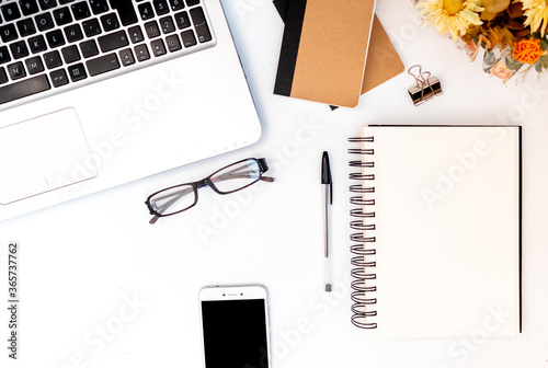Flat lay with blank notebook with copyspace, office of a startup, meetings